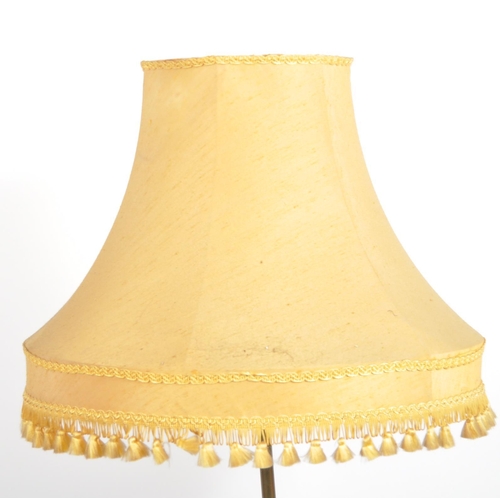 1071 - A 19th century Victorian brass hairy paw feet floor standing standard lamp. Raised  on a stepped cir... 