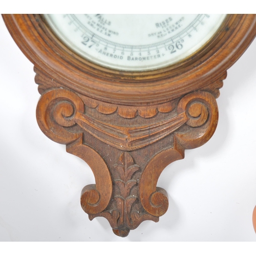 1073 - Early 20th century large oak aneroid wall barometer - thermometer banjo shaped compendium. Carved oa... 