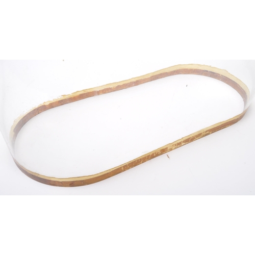 1075 - 19th century French gilt metal 24hour mantel clock with glass dome. The gilt metal clock with boy an... 