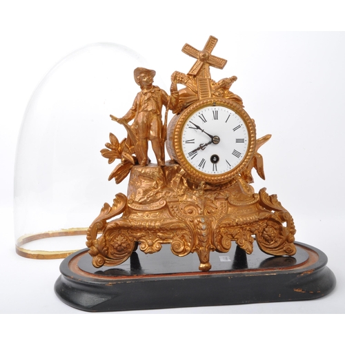 1075 - 19th century French gilt metal 24hour mantel clock with glass dome. The gilt metal clock with boy an... 