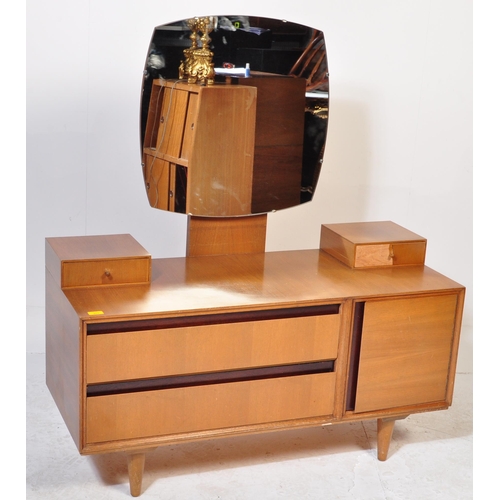 611 - A British Modern Design – Mid century Meredew teak wood and ebonised flash work dressing table being... 