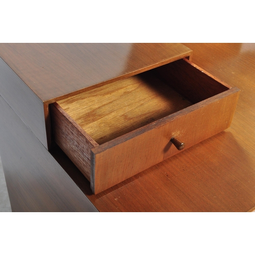 611 - A British Modern Design – Mid century Meredew teak wood and ebonised flash work dressing table being... 