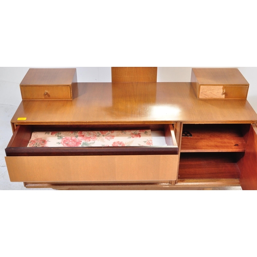 611 - A British Modern Design – Mid century Meredew teak wood and ebonised flash work dressing table being... 