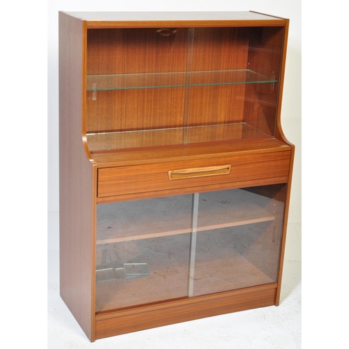 623 - British Modern Design – Mid -century teak veneer drinks display cabinet. Lower sliding door glass ca... 