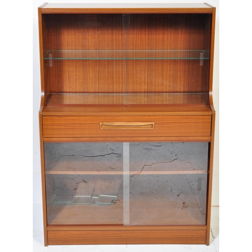 623 - British Modern Design – Mid -century teak veneer drinks display cabinet. Lower sliding door glass ca... 