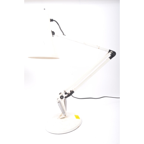 626 - A pair of retro vintage mid 20th Century angle poise desk table lamps. One having a tapering circula... 