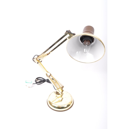 626 - A pair of retro vintage mid 20th Century angle poise desk table lamps. One having a tapering circula... 