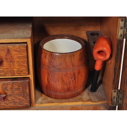 787 - A vintage 20th century circa. 1930's art deco smokers / tobacco cabinet oak cabinet of stepped form.... 