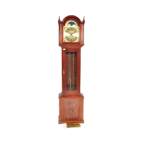 845 - A 20th century longcase grandfather clock. The clock having a gilded face ornate brass spandrels to ... 