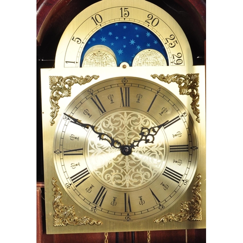 845 - A 20th century longcase grandfather clock. The clock having a gilded face ornate brass spandrels to ... 