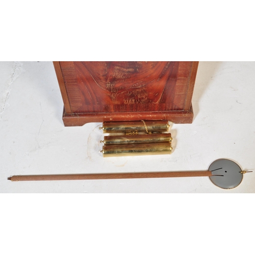 845 - A 20th century longcase grandfather clock. The clock having a gilded face ornate brass spandrels to ... 