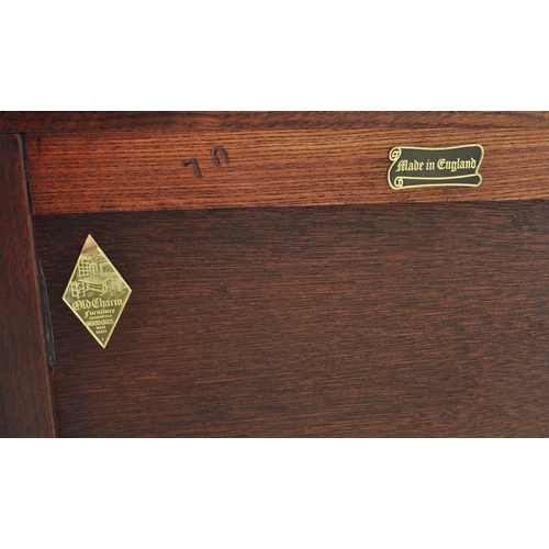 932 - Wood Bros - Old Charm Furniture .A 20th century Jacobean revival  Old Charm oak bedside cabinet / po... 