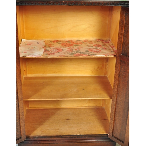 934 - Jacobean revival oak bachelors wardrobe and similar single full size wardrobe, both in the manner of... 