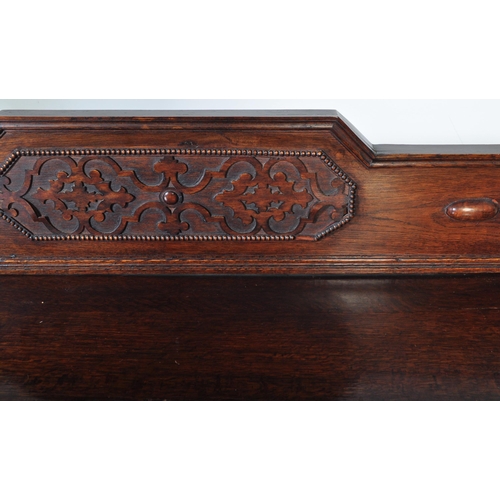 939 - An early 20th century circa. 1920's oak Jacobean Revival sideboard credenza. The sideboard having ga... 