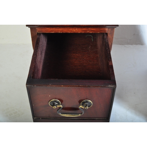 940 - A 20th century George III mahogany and leather twin pedestal kneehole desk. The kneehole desk  havin... 