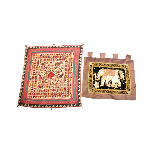 942 - Two vintage 20th century Oriental Middle Eastern hanging wall tapestries. The lot to include floral ... 