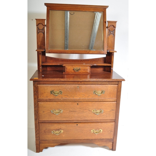 943 - A vintage early 20th Century circa 1920s oak dressing table. Having a swing cheval mirror back, tier... 