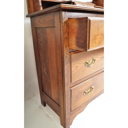 943 - A vintage early 20th Century circa 1920s oak dressing table. Having a swing cheval mirror back, tier... 