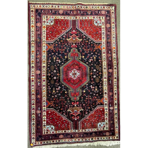 958 - A vintage mid 20th century Persian Islamic Hamadan floor carpet rug having geometric central medalli... 