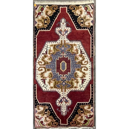 959 - A vintage 20th century 1930s / 40s Turkish Altakula hand knotted floor carpet rug having a geometric... 