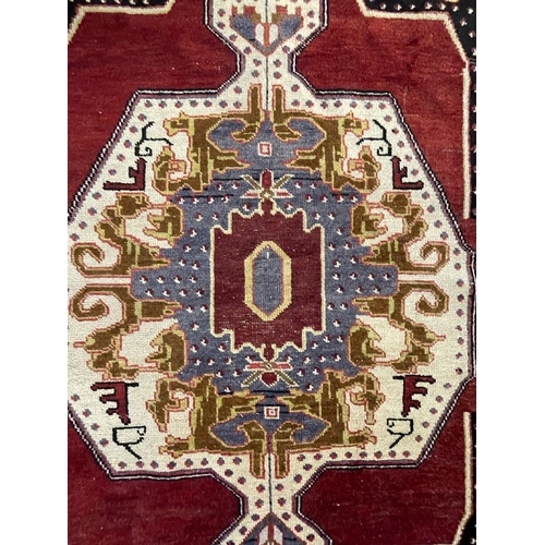 959 - A vintage 20th century 1930s / 40s Turkish Altakula hand knotted floor carpet rug having a geometric... 