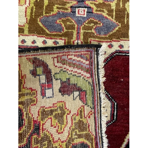 959 - A vintage 20th century 1930s / 40s Turkish Altakula hand knotted floor carpet rug having a geometric... 
