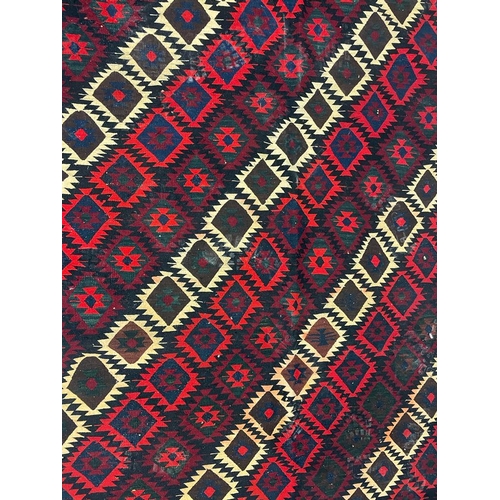 965 - A vintage mid 20th century Persian Islamic South Wes Qashqai Kilim floor rug carpet having a series ... 