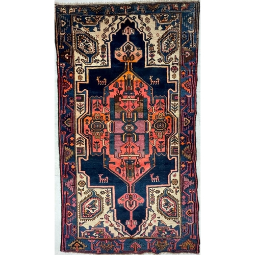 966 - A 20th century Persian Islamic North West Viz flor rug carpet having central polychrome medallion of... 