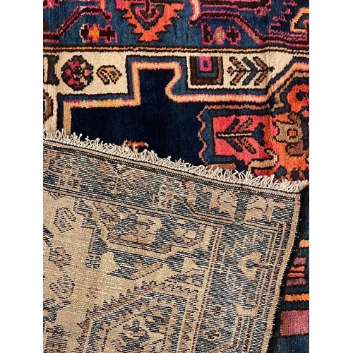 966 - A 20th century Persian Islamic North West Viz flor rug carpet having central polychrome medallion of... 