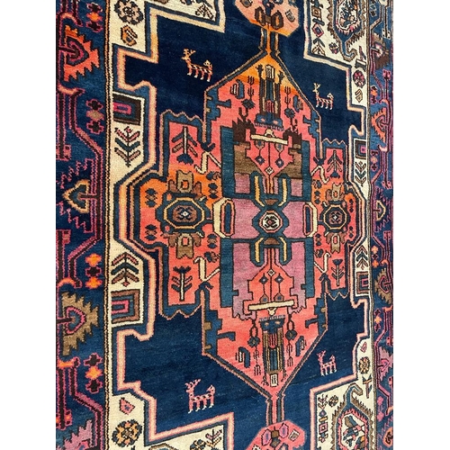 966 - A 20th century Persian Islamic North West Viz flor rug carpet having central polychrome medallion of... 