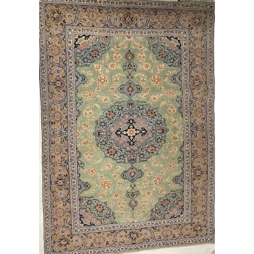 971 - A 20th century Central Persian Islamic Kashan floor rug carpet having a floral shaped central medall... 