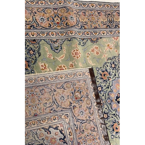 971 - A 20th century Central Persian Islamic Kashan floor rug carpet having a floral shaped central medall... 