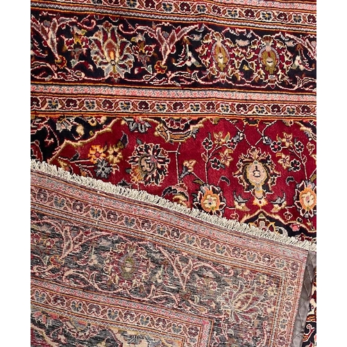 972 - A 20th century Central Persian Islamic Kashan floor rug carpet having a central medallion in light b... 