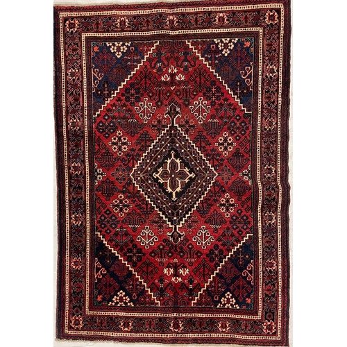 974 - A 20th century North West Persian Islamic Josheghan floor rug carpet having a central medallion surr... 