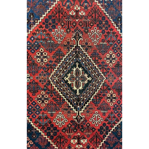974 - A 20th century North West Persian Islamic Josheghan floor rug carpet having a central medallion surr... 