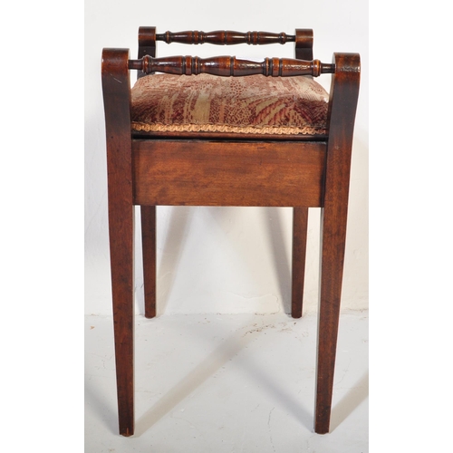 982 - An Edwardian mahogany piano stool seat. Raised on squared legs with upholstered seat having hinged t... 