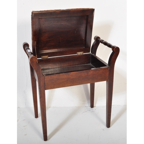 982 - An Edwardian mahogany piano stool seat. Raised on squared legs with upholstered seat having hinged t... 