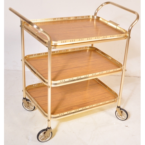 780 - A retro vintage mid 20th century butlers hostess serving cocktail trolley having a three tier of For... 