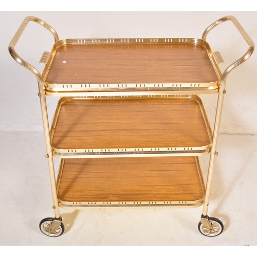 780 - A retro vintage mid 20th century butlers hostess serving cocktail trolley having a three tier of For... 
