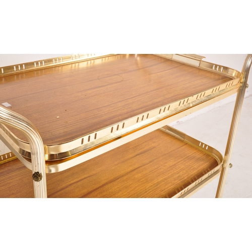 780 - A retro vintage mid 20th century butlers hostess serving cocktail trolley having a three tier of For... 