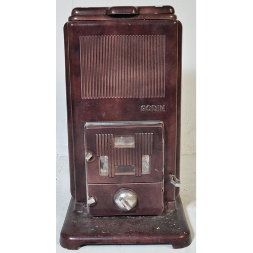 947 - An early 20th century French Godin cast iron log burning stove in a burgundy colourway. Temperature ... 