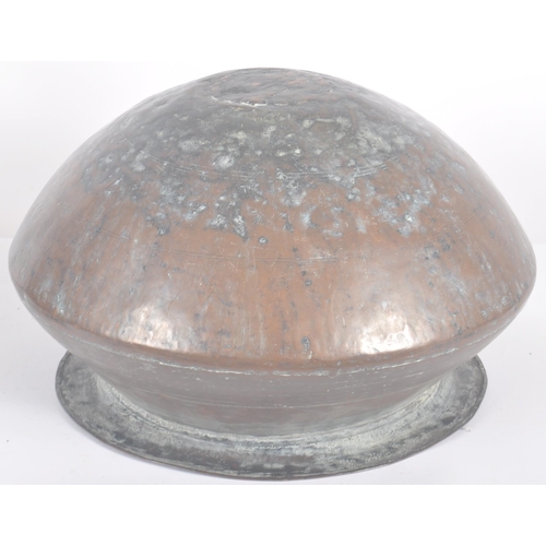 1076 - An 18th Century Indonesian copper serving pot of bulbous circular form having a flat circular rim ov... 