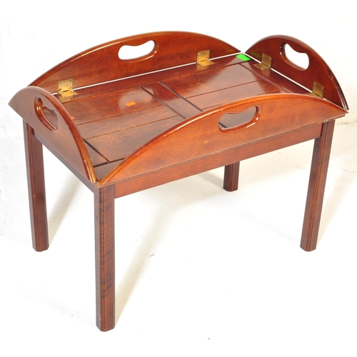 1055 - A 20th century mahogany and brass bound butlers tray coffee table with panelling to top over squared... 