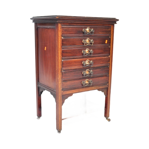 1053 - A 20th century  1920's style music cabinet having a bank of five music sheet filing drawers with hin... 
