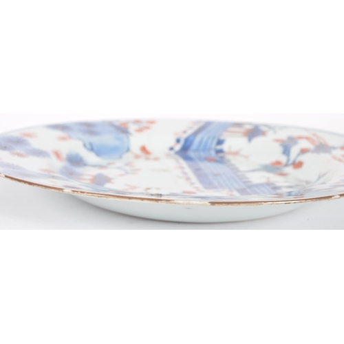 121 - An 18th Century Chinese Imari porcelain plate of circular form. Hand decorated in the Imari palette ... 
