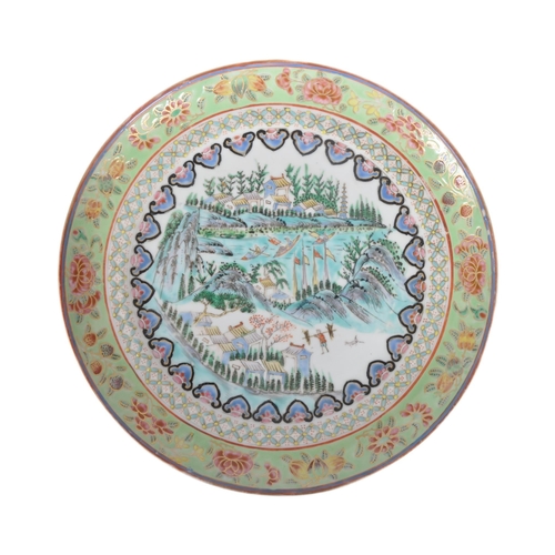 122 - A 19th Century Chinese Famille Verte porcelain plate of circular form. Hand painted Famille Verte de... 