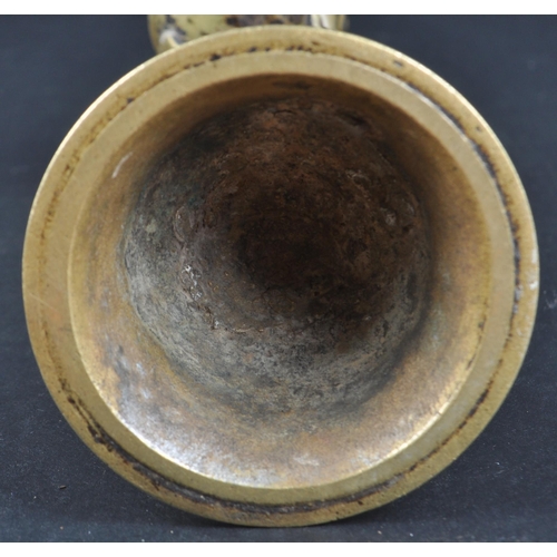 123 - An early 20th Century African Tribal white metal figurine depicting a servant girl. The figure model... 