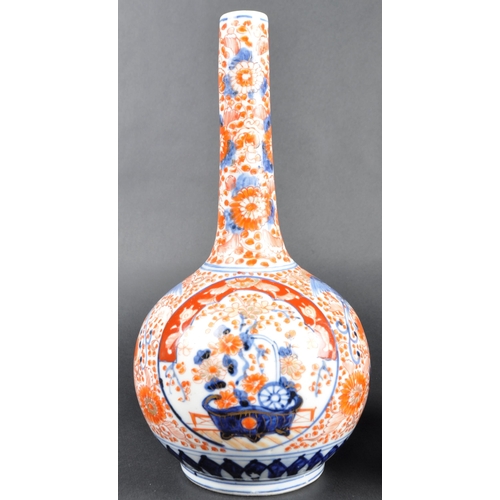 125 - A pair of 19th Century Japanese Meiji period Imari porcelain bottle vases. Tapering cylindrical neck... 