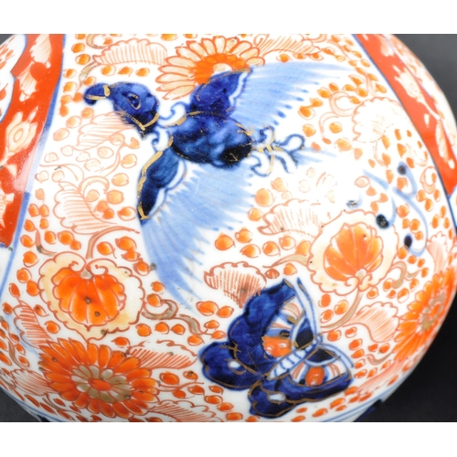 125 - A pair of 19th Century Japanese Meiji period Imari porcelain bottle vases. Tapering cylindrical neck... 