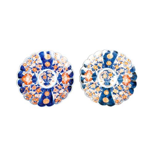 126 - A pair of 19th Century Japanese Meiji period Imari chargers of fluted form. Both with hand painted r... 